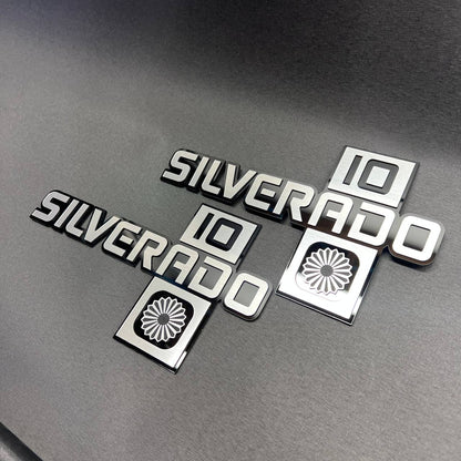 Brushed silver Silverado 10 badge with black background