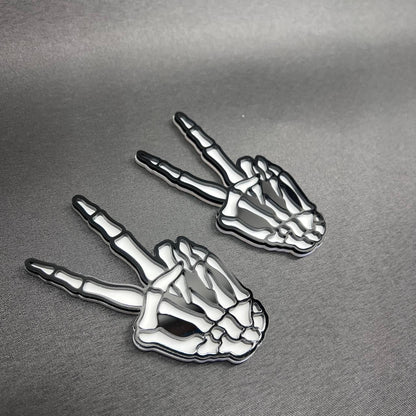 Skeleton shaka hand car emblem for fender, tailgate, or exterior trim.