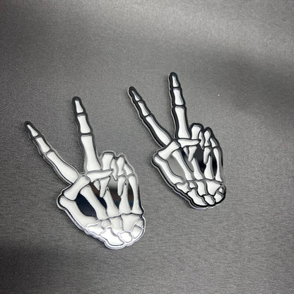 Skeleton hang loose auto accessory badge for custom vehicle styling.