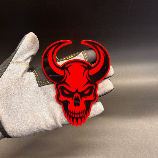 Demon skull automotive badge with bold red and black design