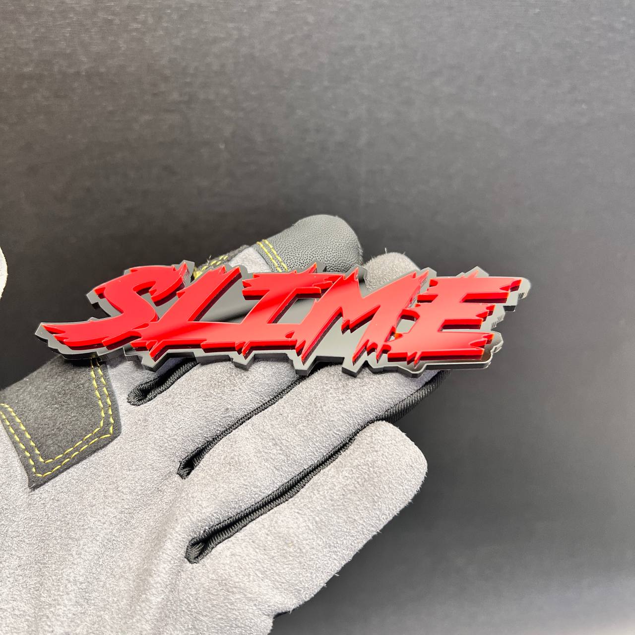 Red SLIME automotive badge with aggressive jagged lettering