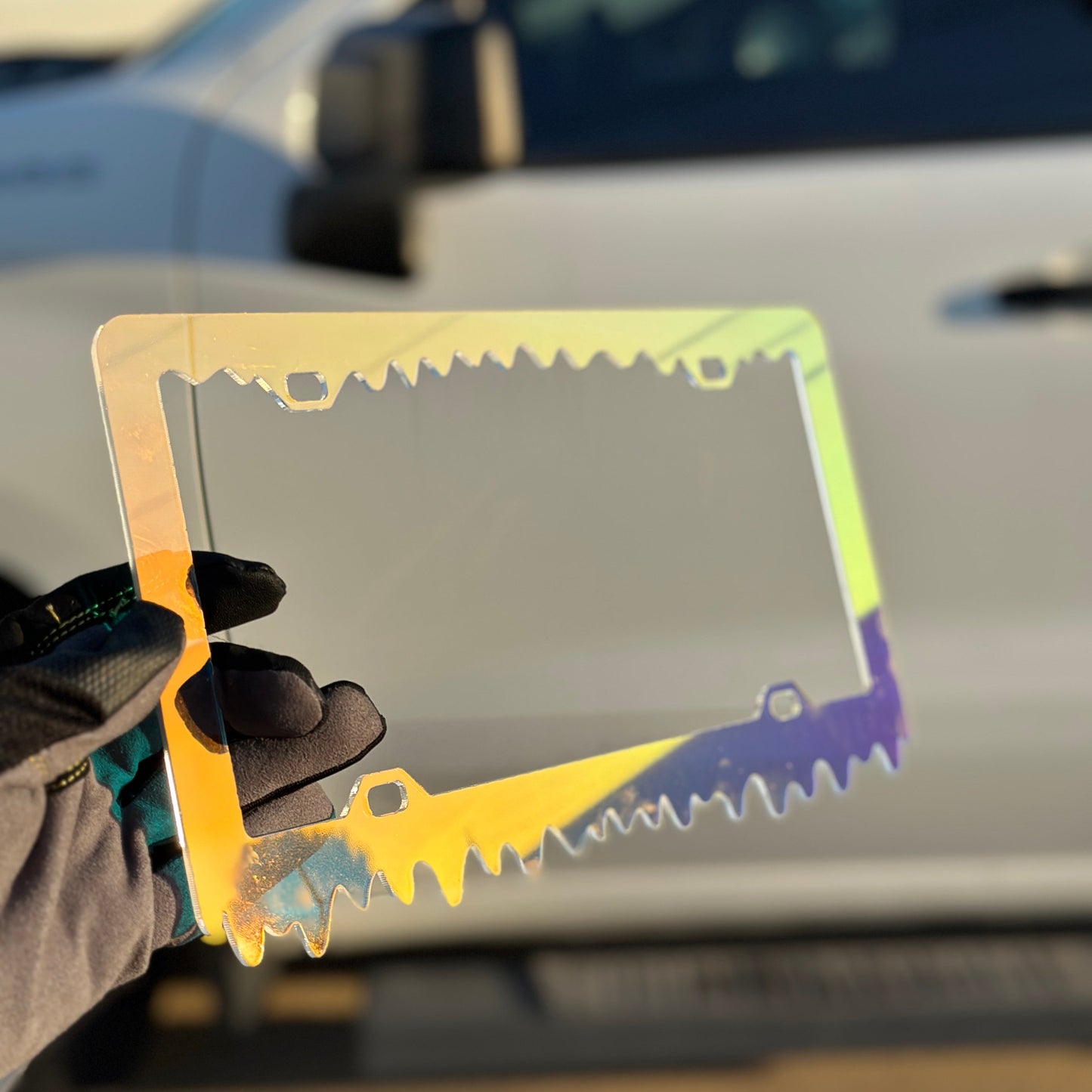 Reflective chameleon license plate frame with bold slime design