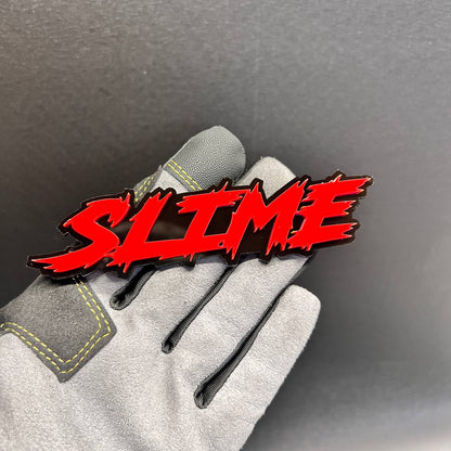 SLIME car lettering badge featuring glossy red text on black
