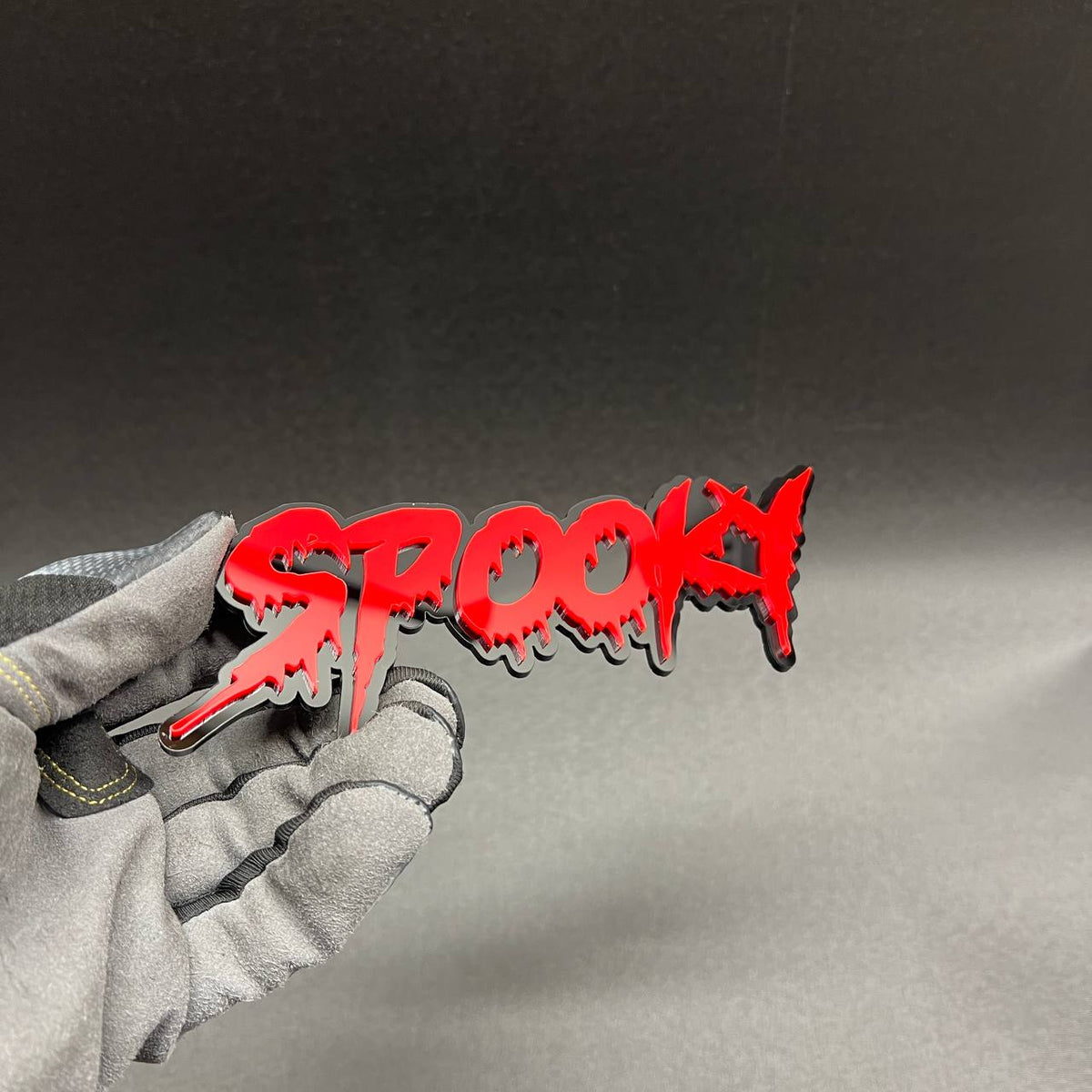 Spooky automotive badge in red and black designed for custom car truck or SUV exterior decoration