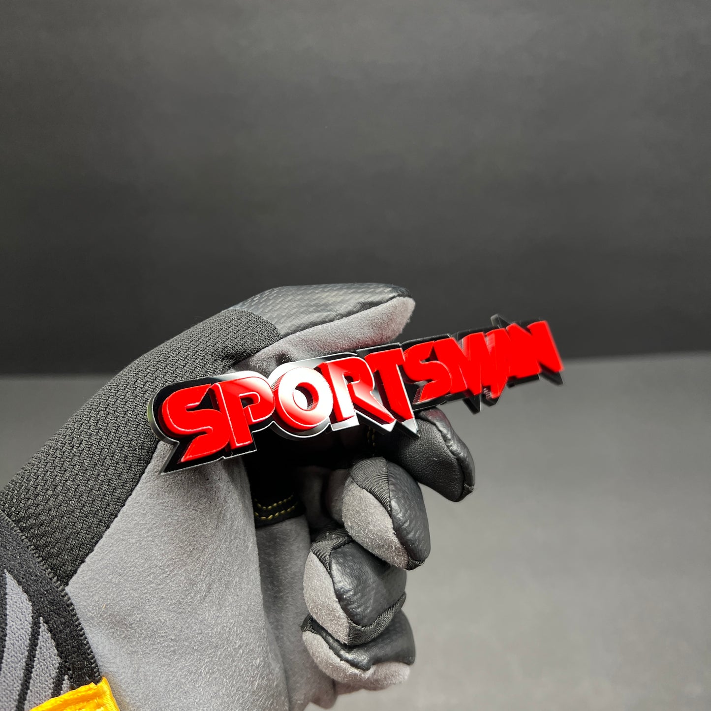 Red SPORTS MAN car badge decal mounted with durable automotive acrylic construction and 3M adhesive