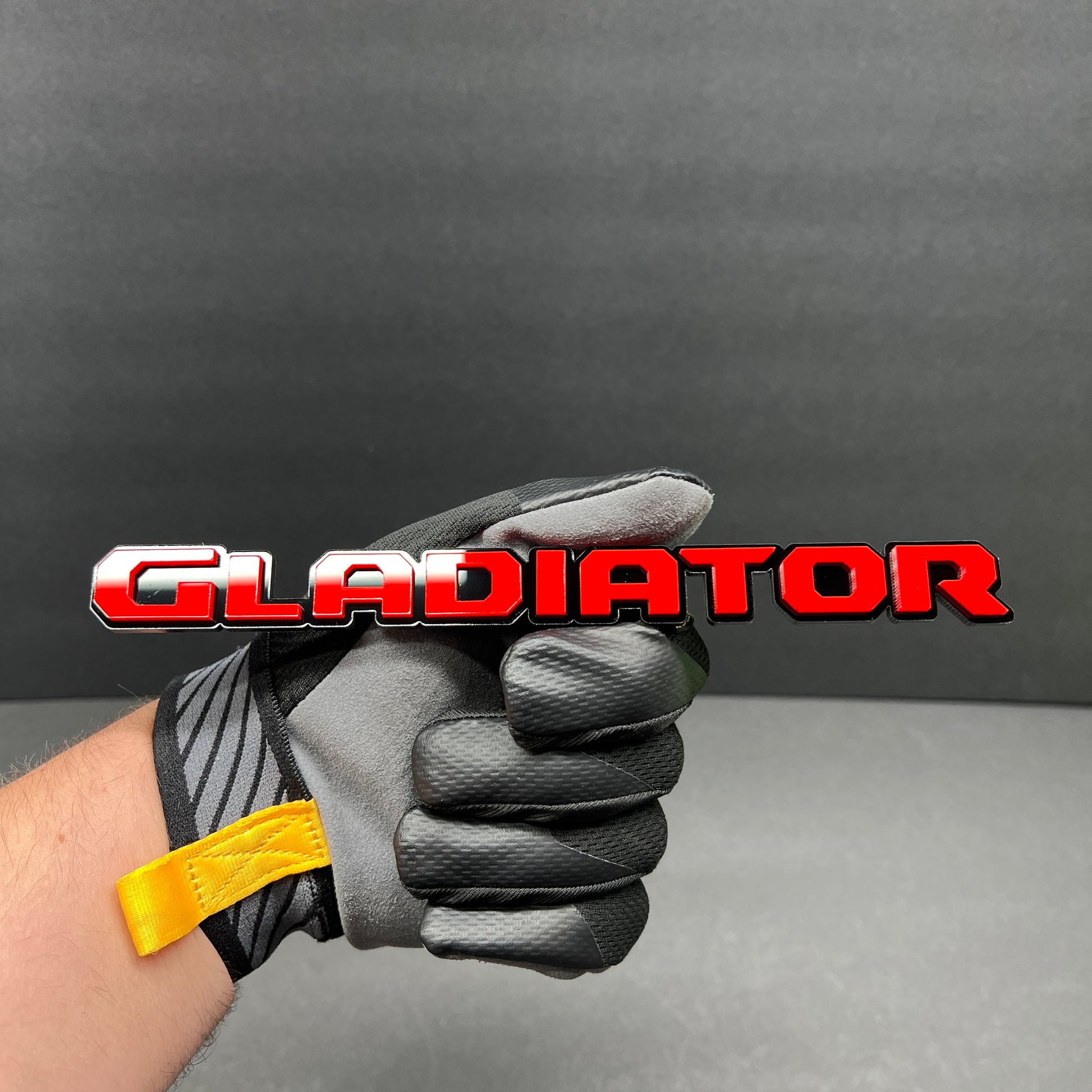 Premium custom GLADIATOR acrylic badge with aggressive performance style font