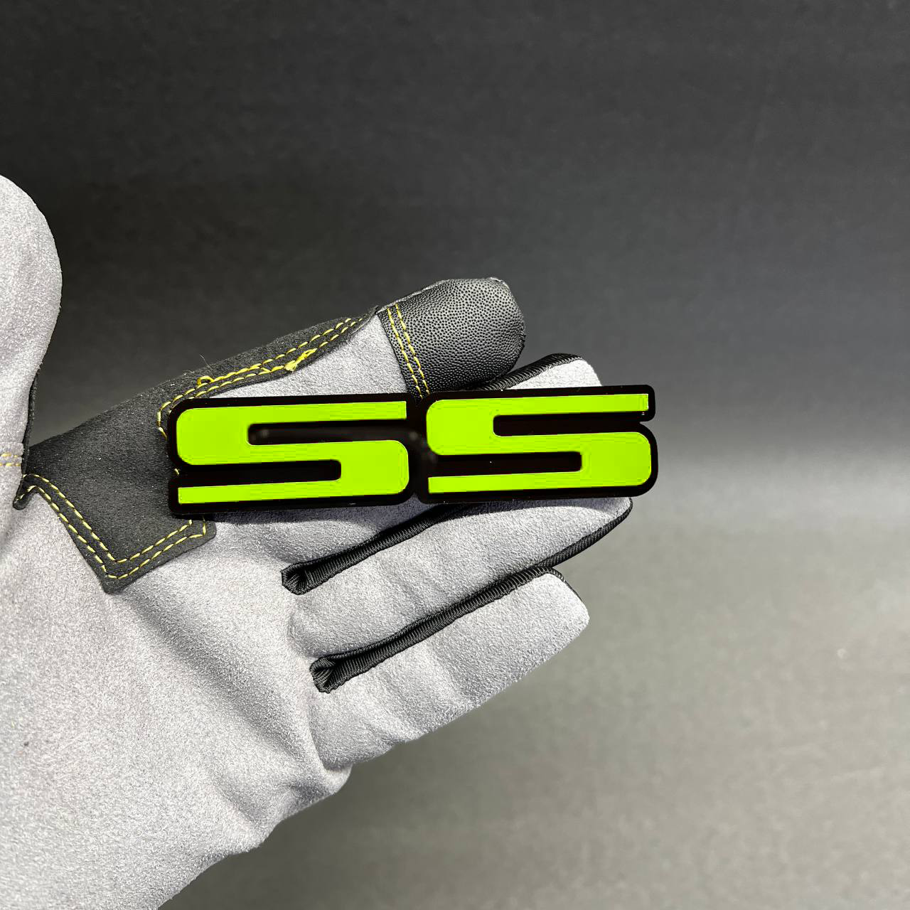 Red black SS automotive emblem for Chevrolet muscle, sport, hood, fender, or trunk badge use.