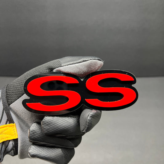 Red and black SS custom acrylic car badge for vehicle exterior.