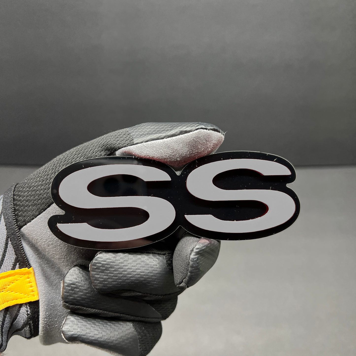 Custom red SS badge for fender, tailgate, or grille installation.