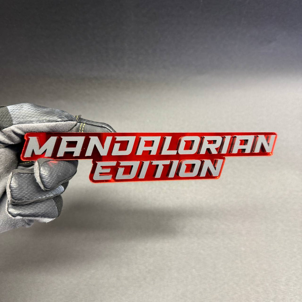 Star Wars Mandalorian Edition car badge featuring silver lettering on a glossy red background, custom aftermarket fender emblem for Ford F150 and F250 trucks.