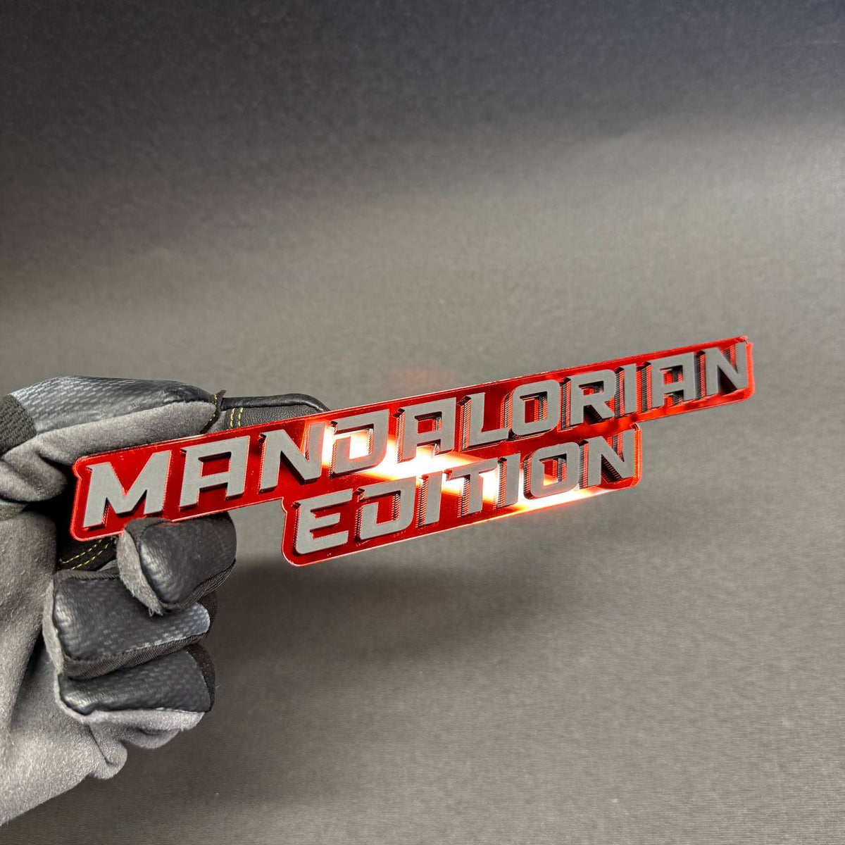 Mandalorian Edition custom car emblem in red and silver, laser-cut two-layer automotive badge for Chevrolet Silverado and Colorado trucks.