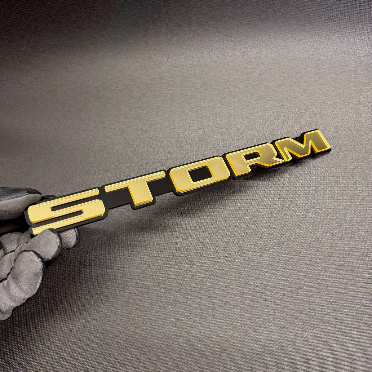 Custom STORM text automotive badge, exterior car emblem for Jeep, Toyota, Nissan, Ford, Dodge and Chevrolet vehicles.