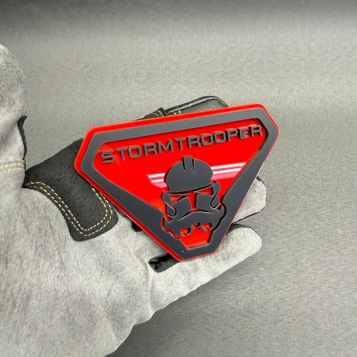 Red and black Stormtrooper inspired automotive emblem for Jeep Wrangler, Gladiator, Ford Bronco and custom off-road vehicle styling.