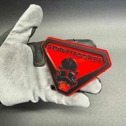 Sci-fi inspired Stormtrooper car badge with red and black layered design for Toyota Tacoma, Tundra, 4Runner and Jeep off-road accessories.