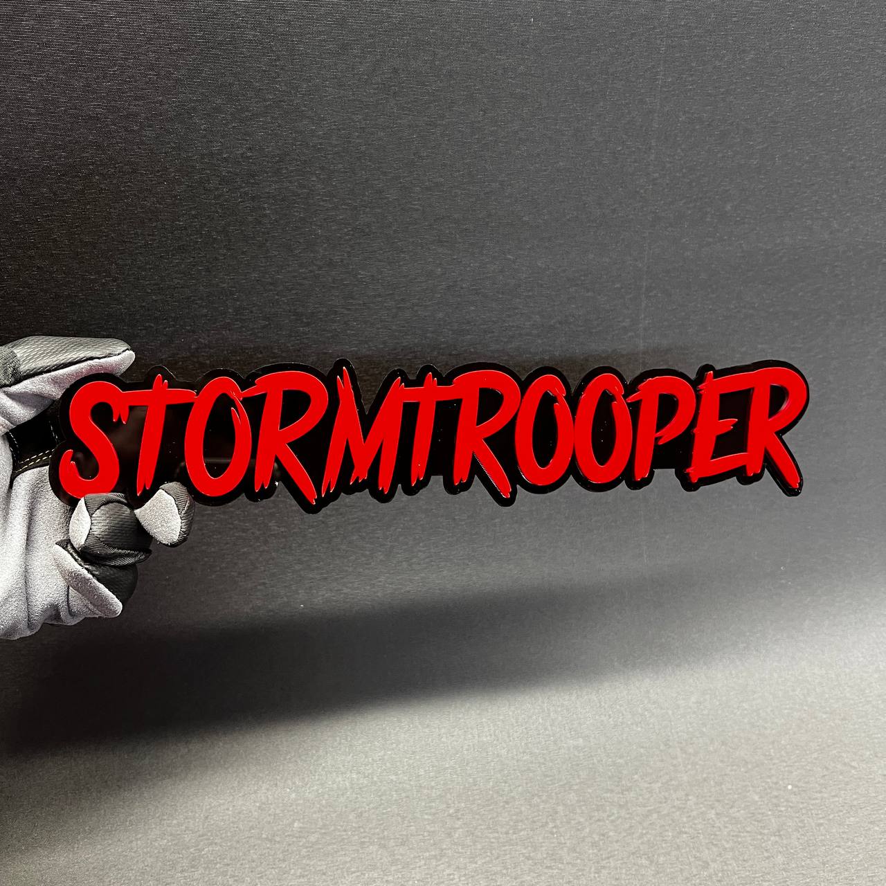 Red and black custom Stormtrooper nameplate emblem for automotive exterior