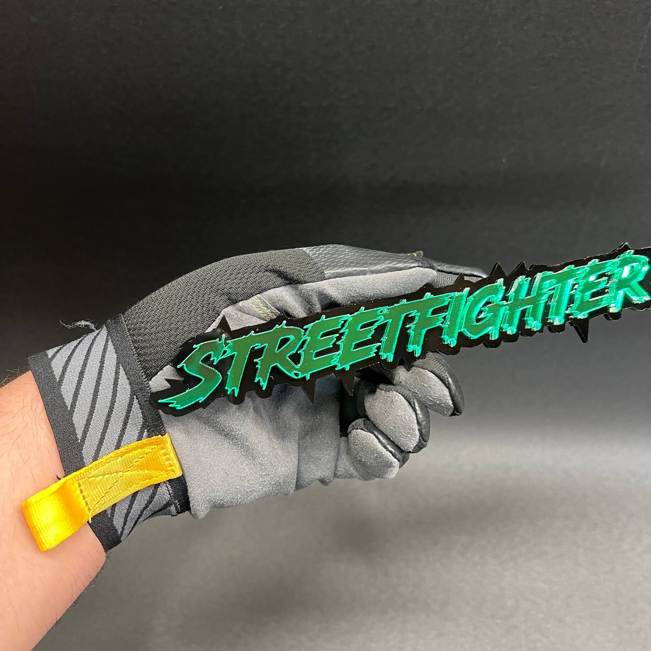 Street Fighter custom acrylic text badge in green mirror finish with black outline for truck fender and tailgate styling