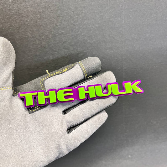 Green and purple The Hulk car badge with raised 3D lettering