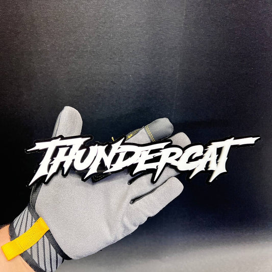 THUNDERCAT car badge fender emblem with white lettering and black background