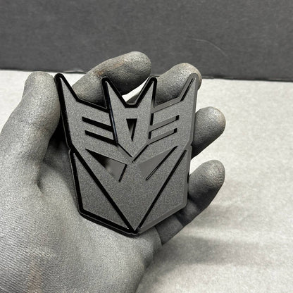 Back of Decepticon car emblem with automotive 3M adhesive for peel-and-stick installation