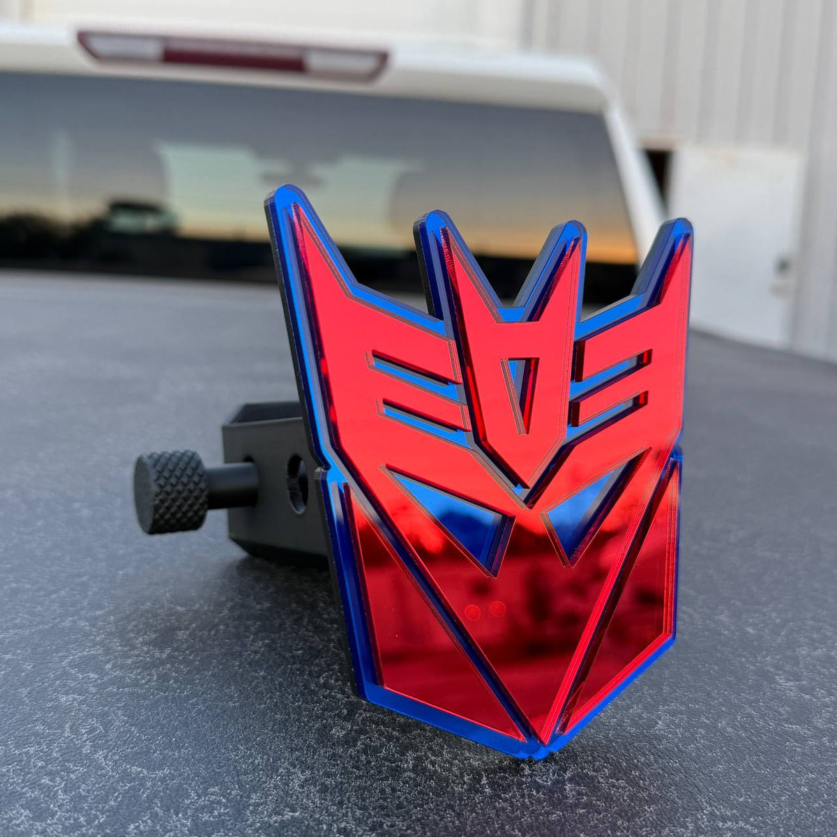 Custom Decepticon logo hitch cover for Jeep Wrangler trailer hitch receiver.
