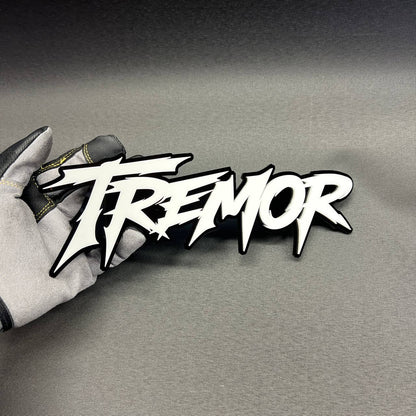 TREMOR truck fender badge with aggressive performance style lettering