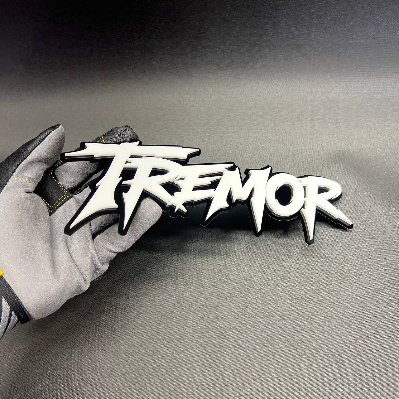 White and black TREMOR vehicle emblem custom exterior badge