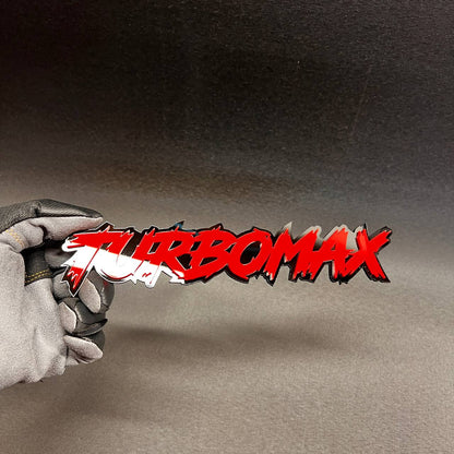 Custom TURBOMAX automotive badge in glossy red with black backing.