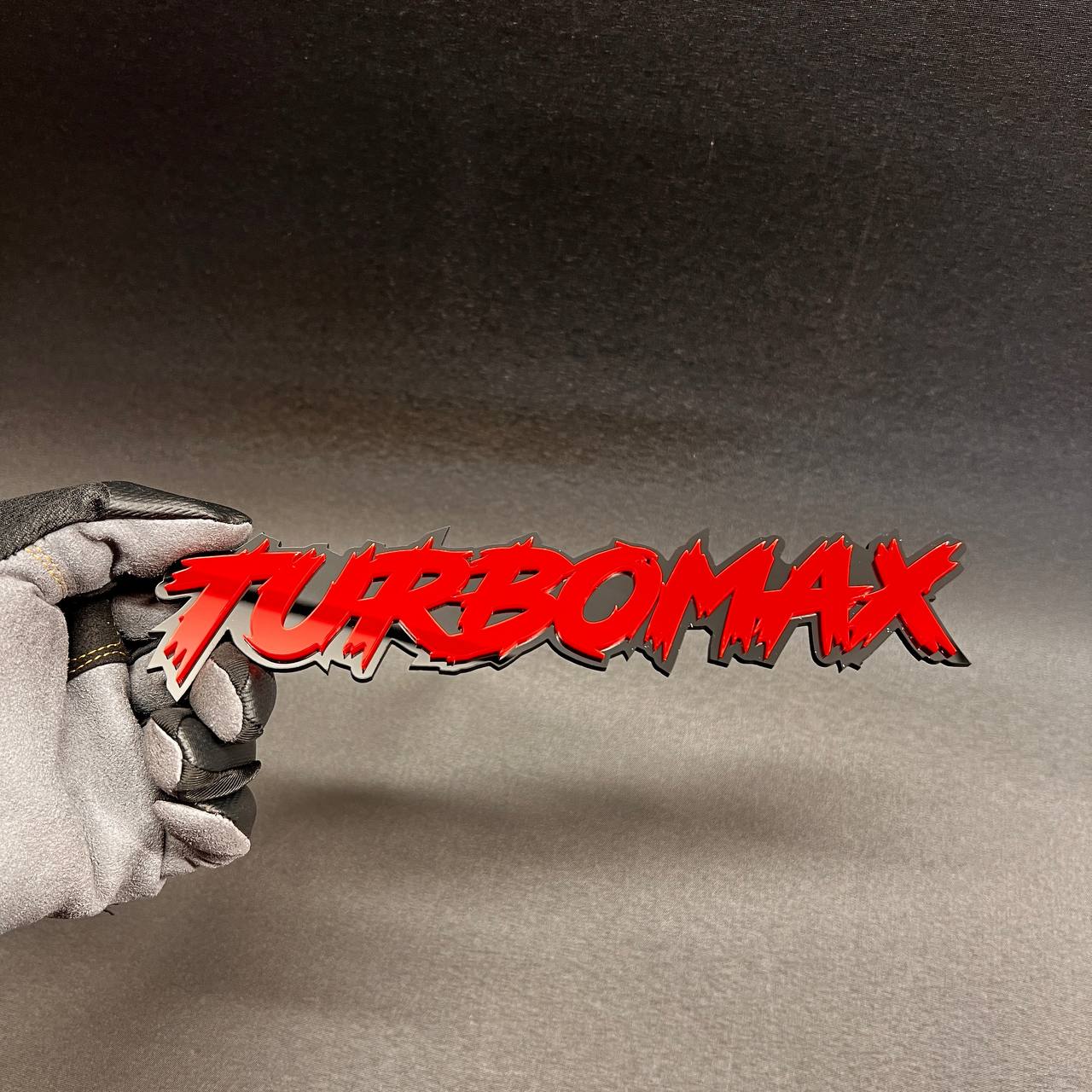 Red TURBOMAX custom car badge with durable weather-resistant finish.