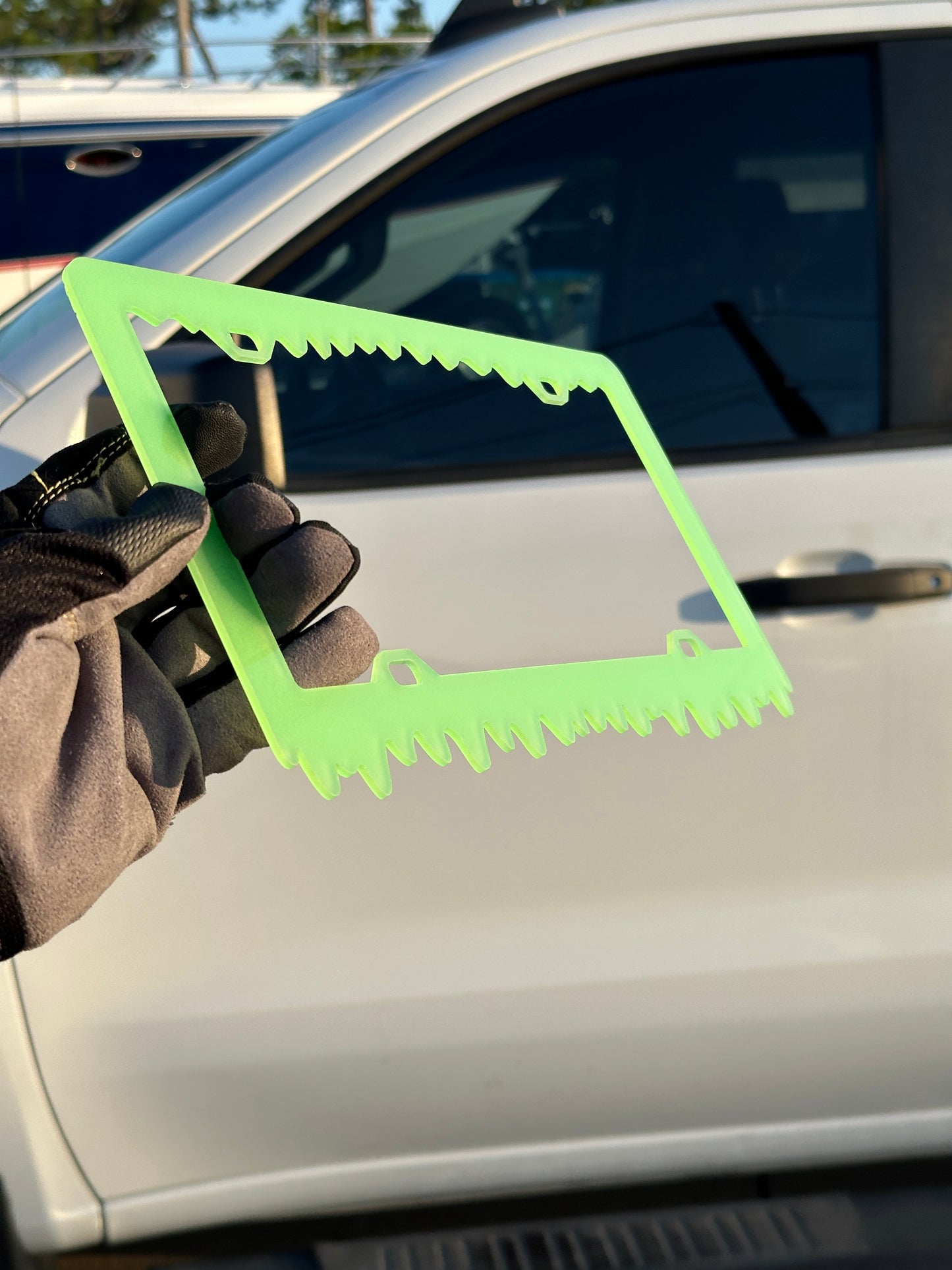 Neon style glow in the dark plate frame for cars and trucks