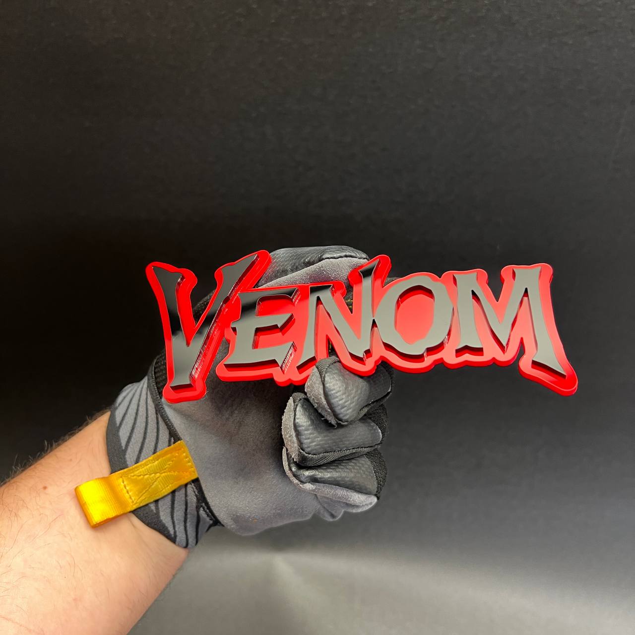 Black and red VENOM text badge for custom automotive decal and tailgate emblem applications