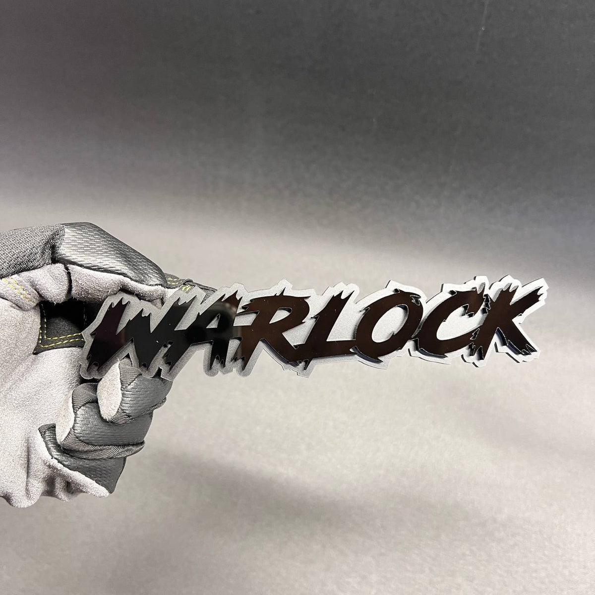 WARLOCK text car badge emblem in black and silver for custom vehicle exterior styling