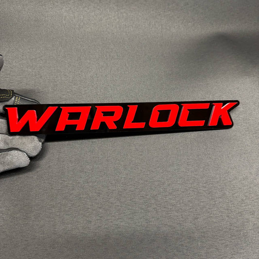 WARLOCK car badge with red lettering and glossy black background custom automotive emblem