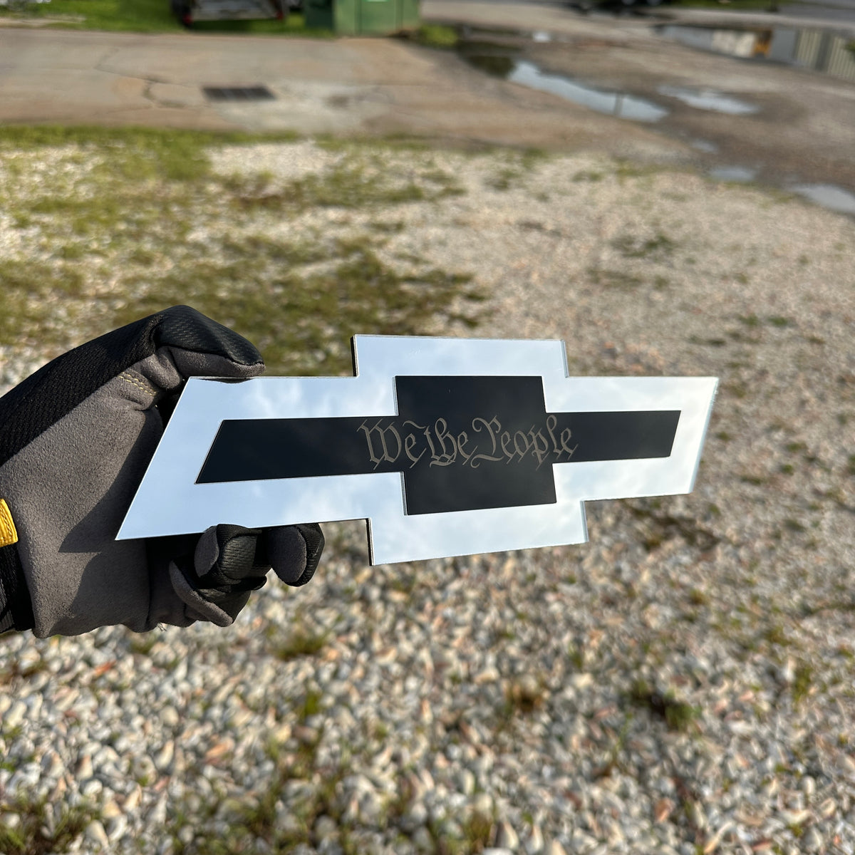 Chevrolet receiver hitch cover with silver Bowtie shape and gold Autobot center