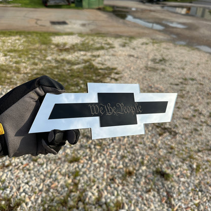 Chevrolet receiver hitch cover with silver Bowtie shape and gold Autobot center