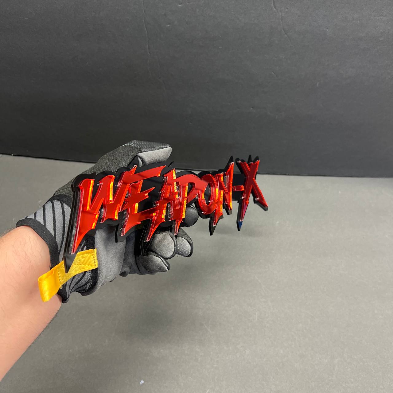 Glossy red and black Weapon X text badge for Silverado tailgate decal