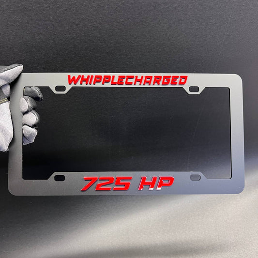 Whipplecharged 725 HP car license plate frame with red raised lettering and black finish.