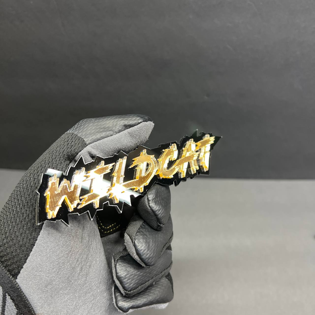 Glossy black and mirror gold Wildcat automotive acrylic badge decal