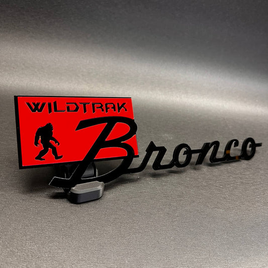 Wildtrak Sasquatch custom car text badge with black acrylic lettering for Bronco exterior styling. Fits Bronco