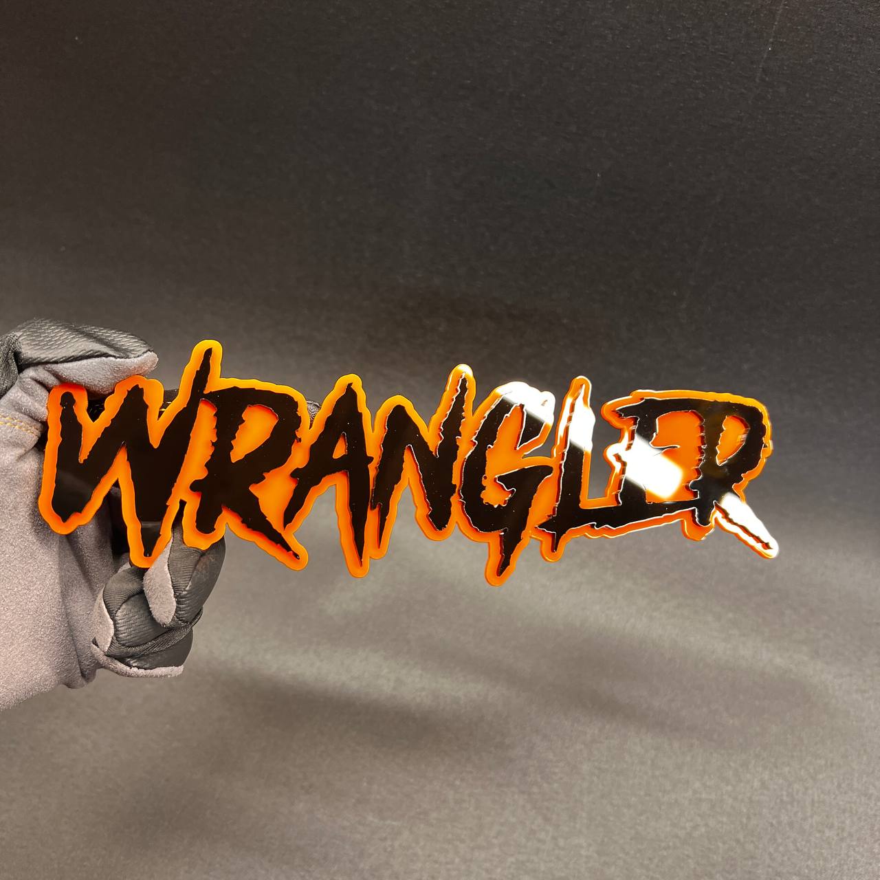 Wrangler custom automotive badge with premium layered acrylic finish.