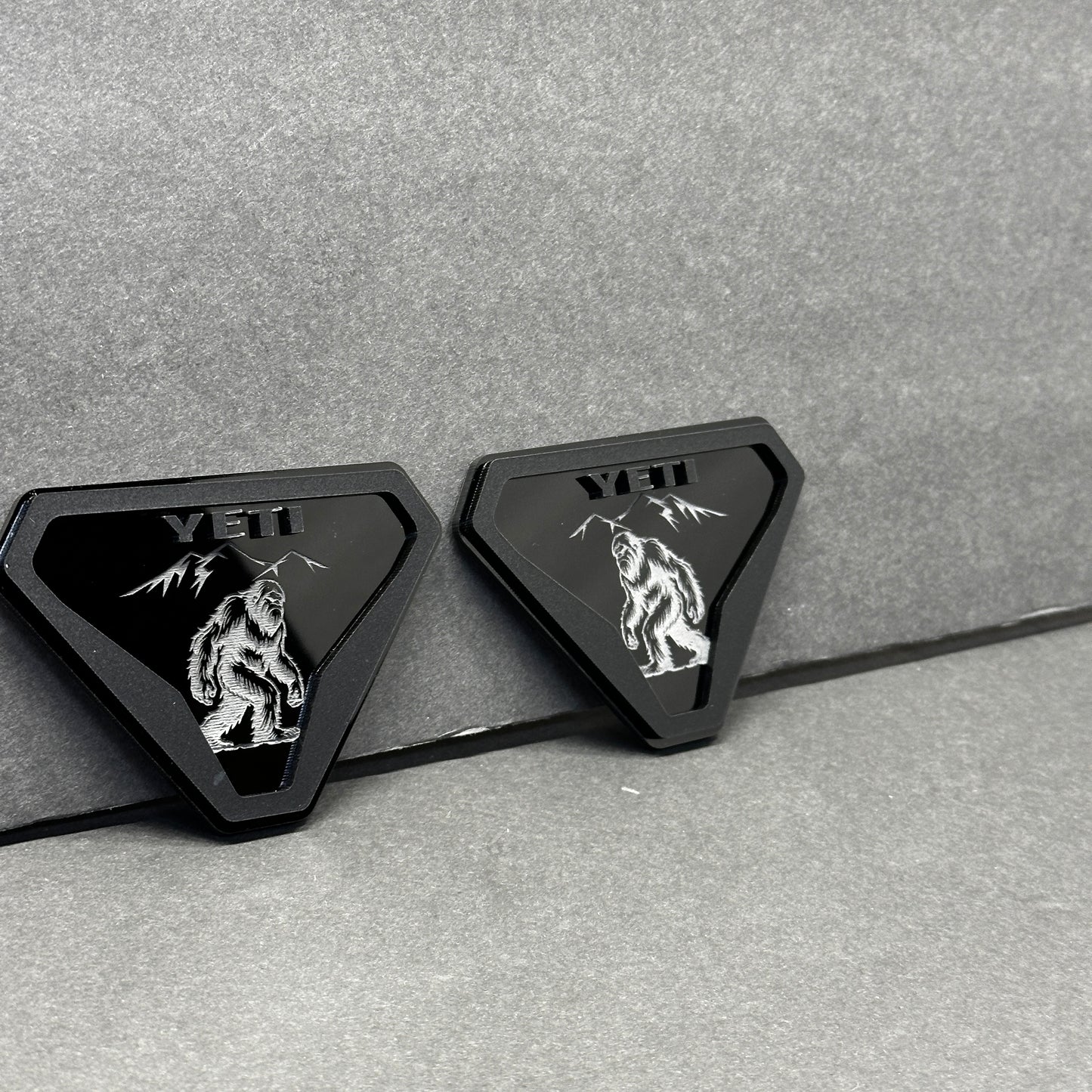 Silver black Yeti walking creature emblem with mountain design